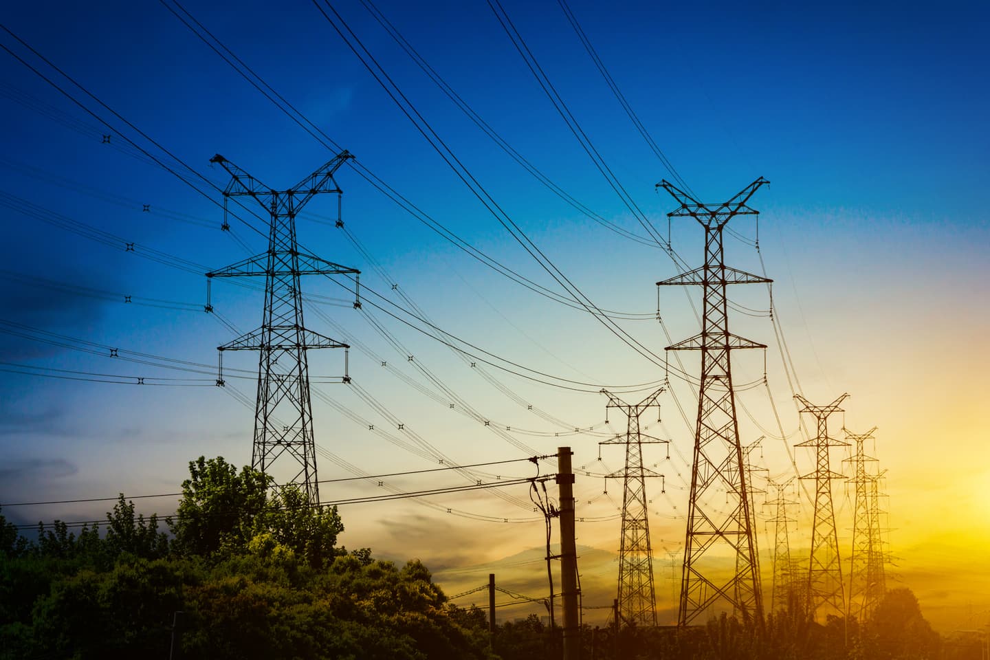 Sun set silhouette of electrical power lines